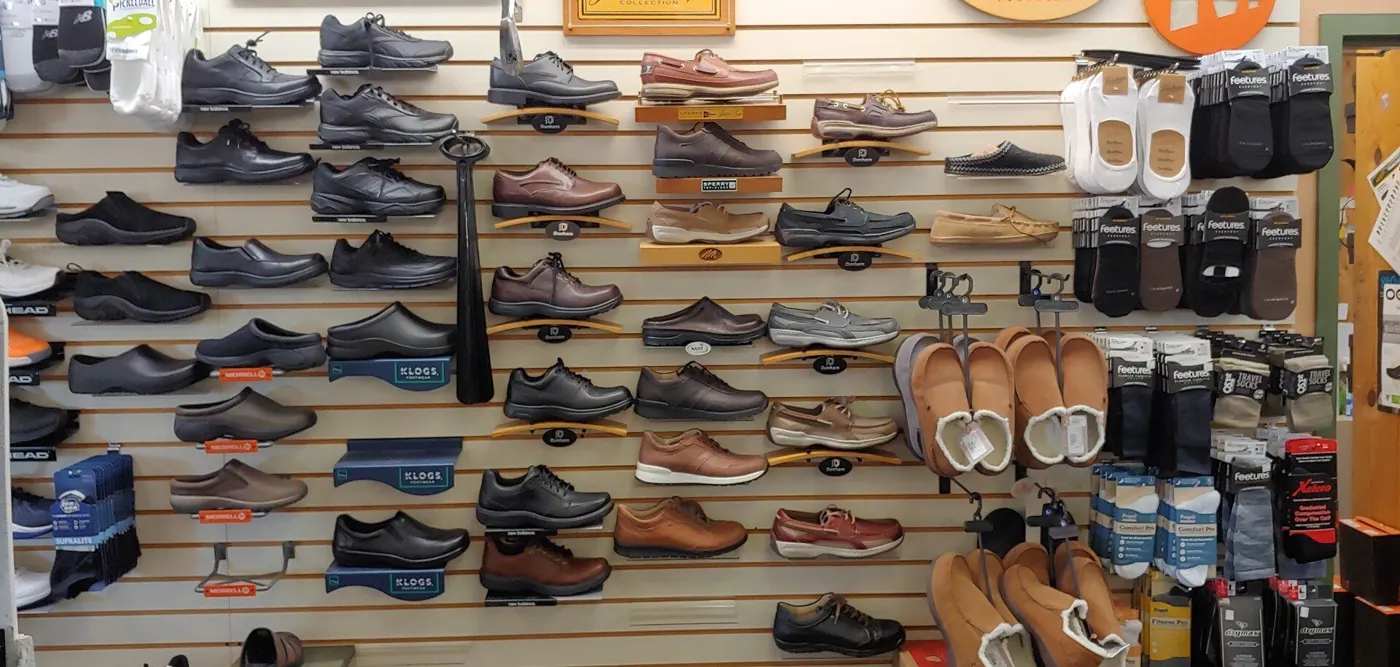 Wall of men's casual and dress shoes